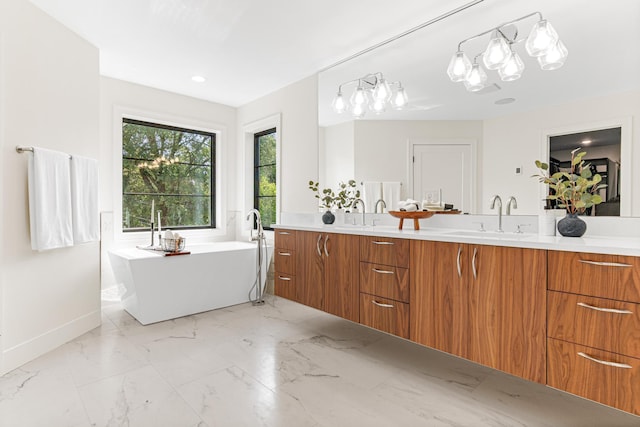 bathroom featuring a tub and vanity