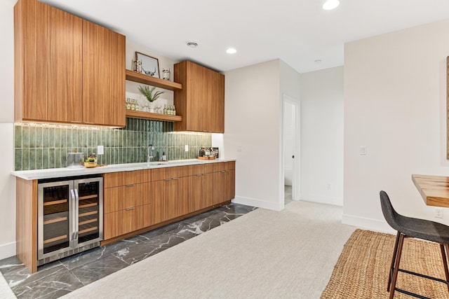 kitchen featuring beverage cooler and decorative backsplash