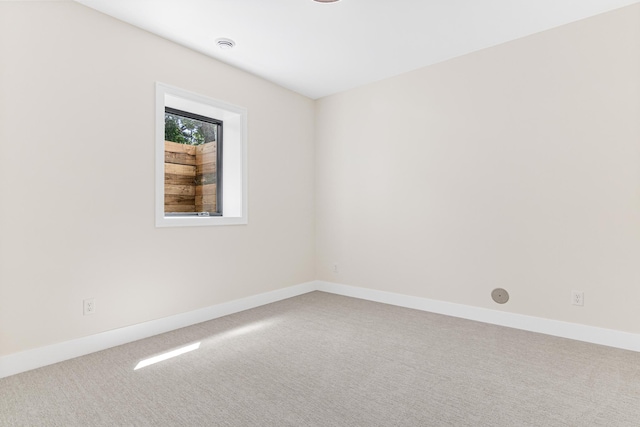 unfurnished room with carpet flooring