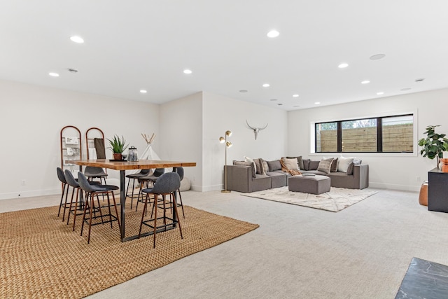 dining room featuring light carpet