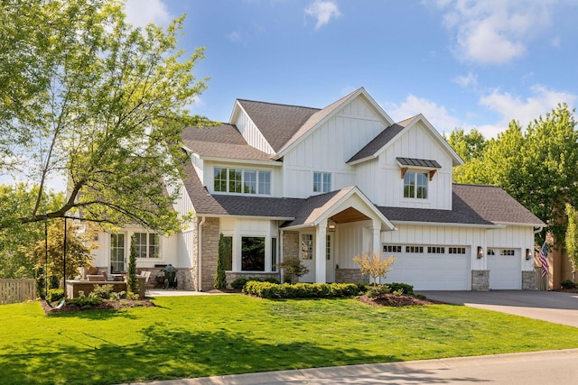 view of front facade with a garage and a front lawn