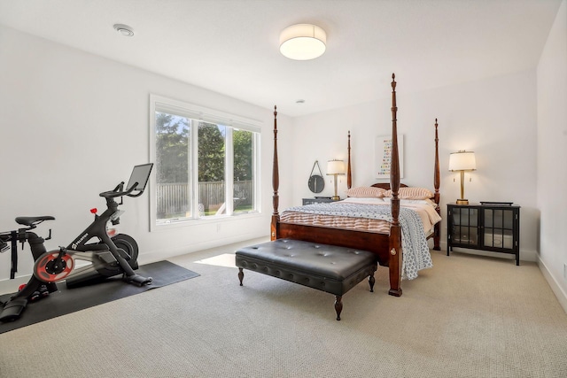 bedroom featuring light colored carpet