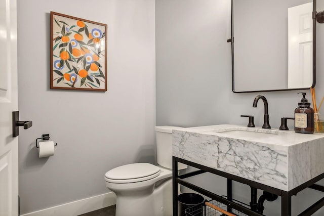 bathroom with sink and toilet