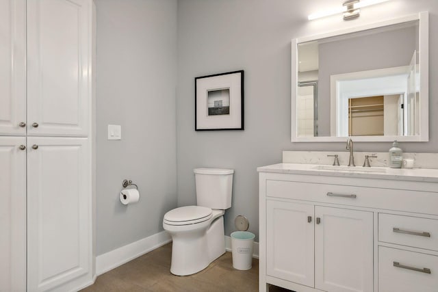 bathroom featuring toilet and vanity