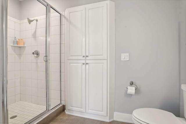 bathroom with toilet and walk in shower