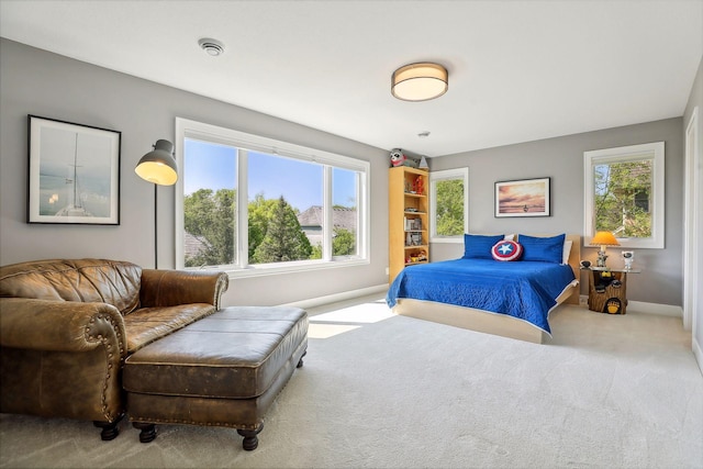 bedroom featuring light carpet