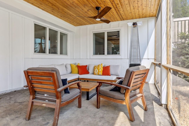 sunroom / solarium featuring ceiling fan and wood ceiling