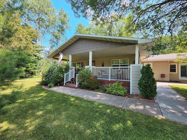 view of front of house featuring a front yard and a porch