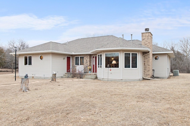 ranch-style home featuring central AC unit