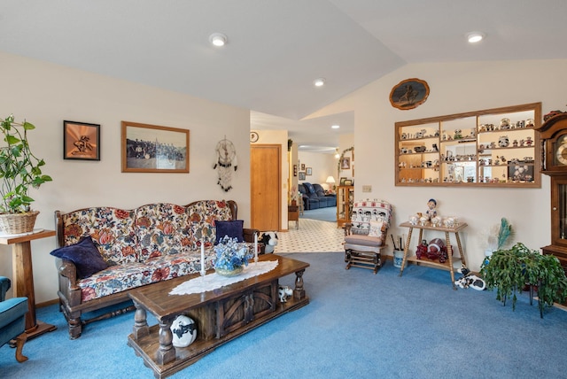 carpeted living room featuring vaulted ceiling