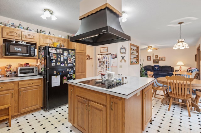 kitchen featuring island exhaust hood, a center island, a textured ceiling, ceiling fan, and black appliances