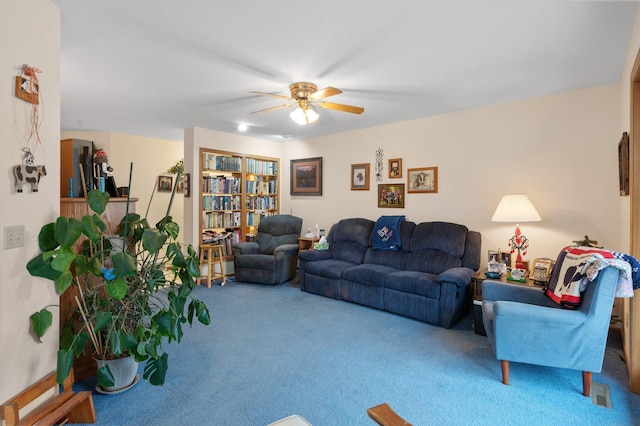 living room with ceiling fan and carpet flooring