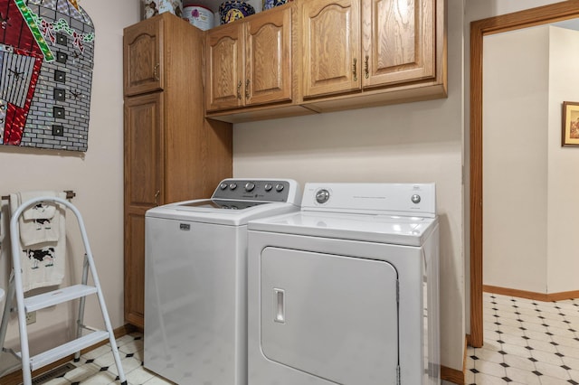 laundry area with cabinets and independent washer and dryer