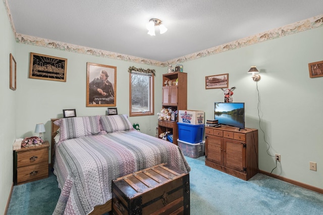 carpeted bedroom with a textured ceiling