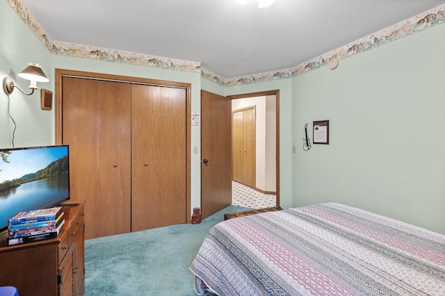 bedroom featuring light carpet and a closet