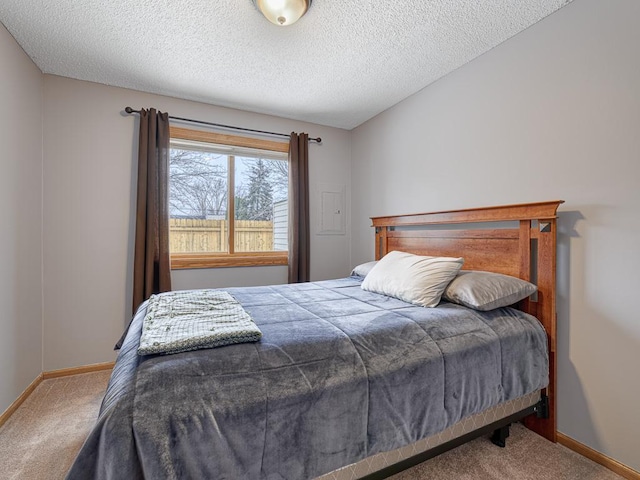 carpeted bedroom with a textured ceiling