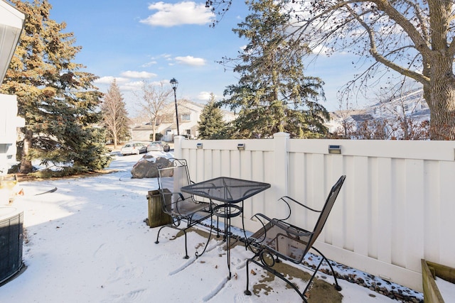 snow covered patio featuring a mountain view