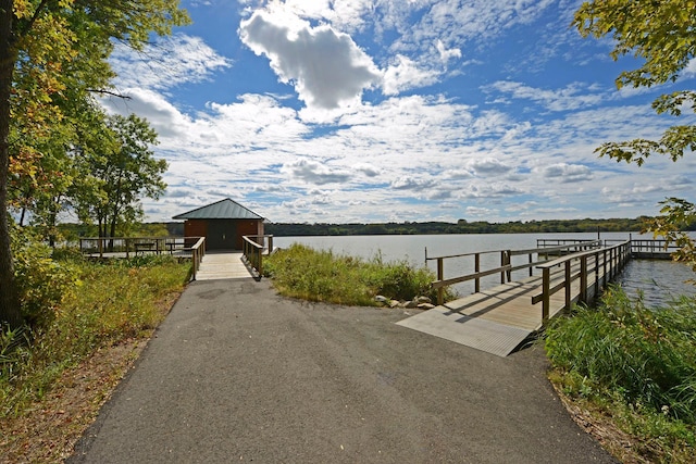 dock area featuring a water view