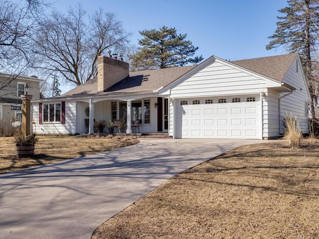 single story home with roof with shingles, driveway, an attached garage, covered porch, and a chimney