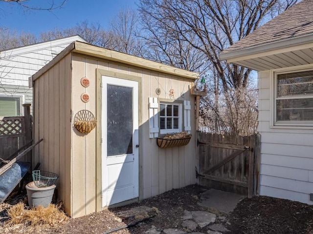 view of shed with a gate and fence