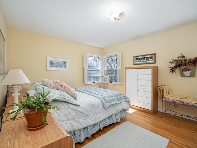 bedroom featuring wood finished floors