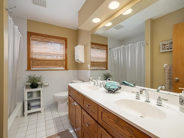 full bath featuring a sink, visible vents, and tile patterned flooring