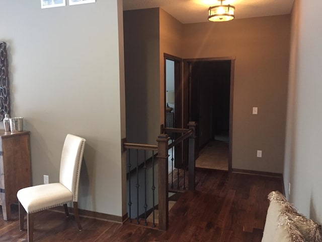 hall with dark wood-type flooring