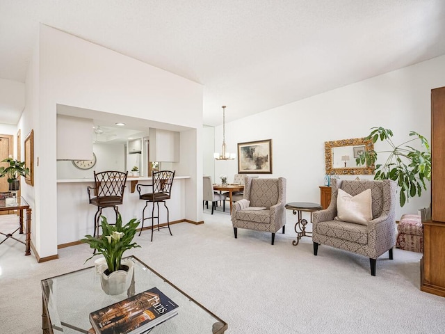 carpeted living area featuring an inviting chandelier and baseboards