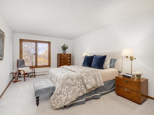 carpeted bedroom with baseboards and a textured ceiling