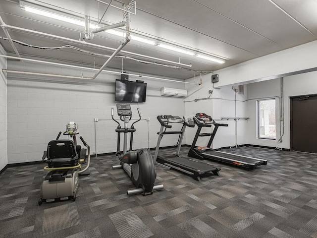 exercise room with a wall unit AC