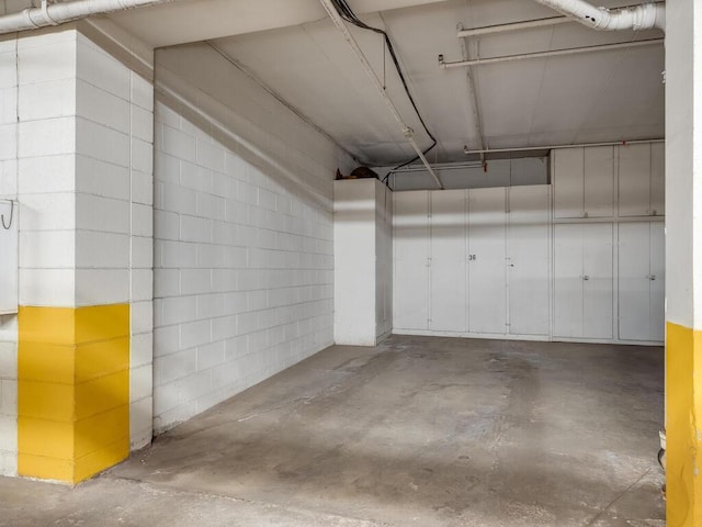 parking deck featuring concrete block wall