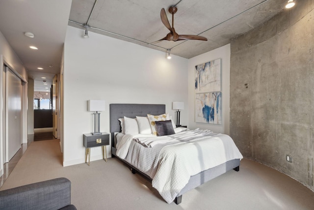 bedroom featuring ceiling fan and carpet