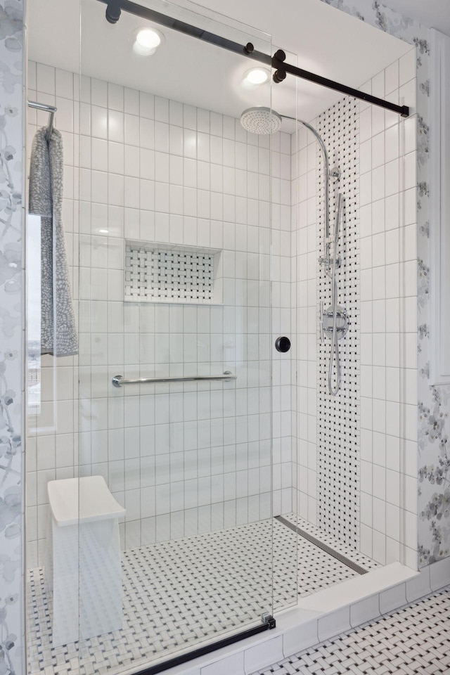 bathroom featuring an enclosed shower and tile patterned flooring