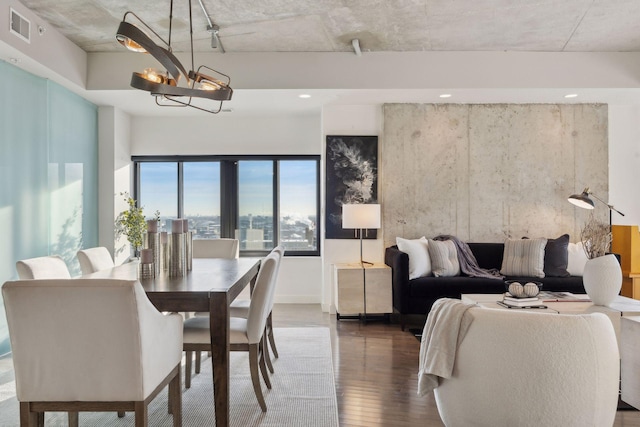 dining room featuring a chandelier and dark hardwood / wood-style floors