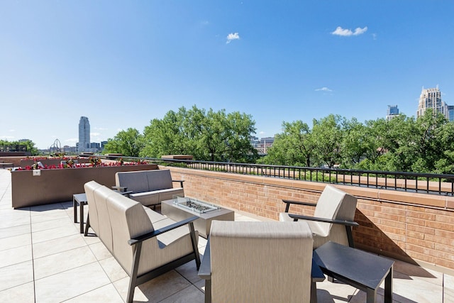 view of patio / terrace featuring an outdoor living space with a fire pit