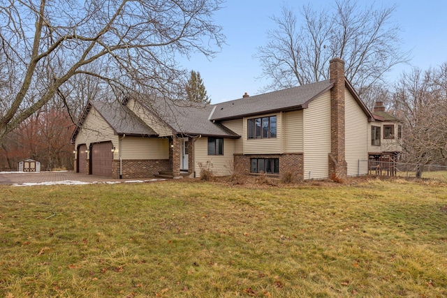 view of front of property with a garage and a front yard