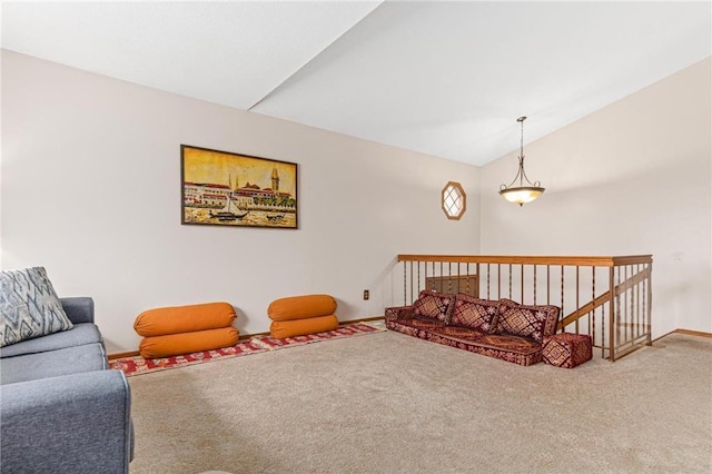 living room featuring vaulted ceiling and carpet