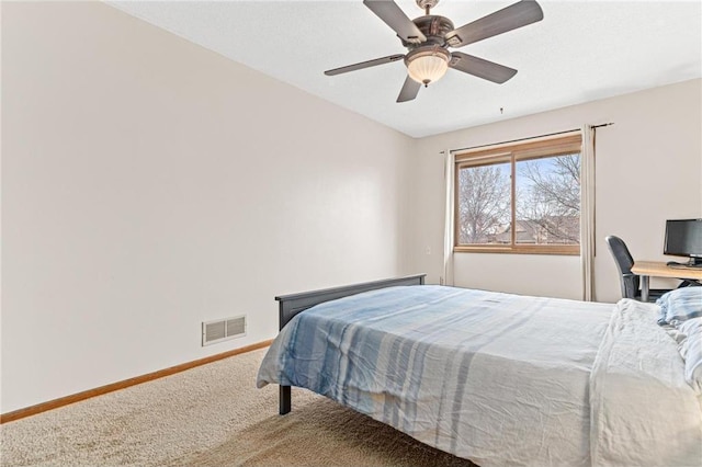 carpeted bedroom with ceiling fan