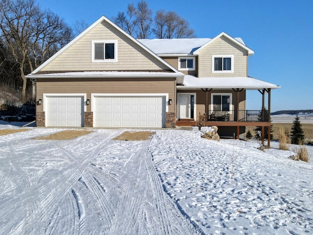 view of front of home featuring a porch and a garage