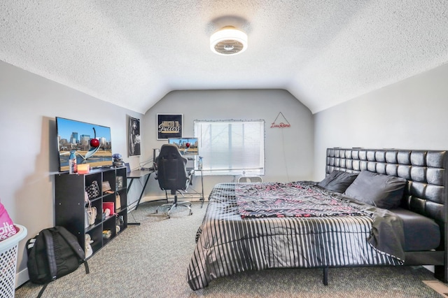 bedroom featuring vaulted ceiling, a textured ceiling, and carpet