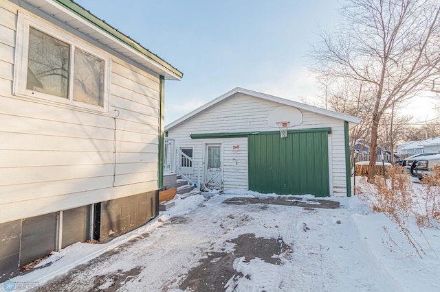 view of snow covered garage