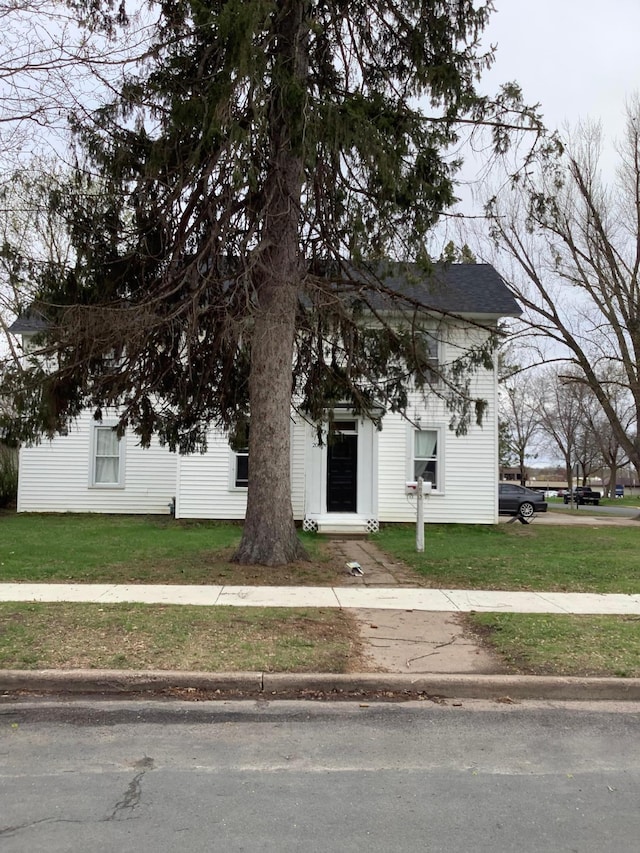 203 4th St, River Falls, WI 54022 - view of property hidden behind natural elements with a front yard