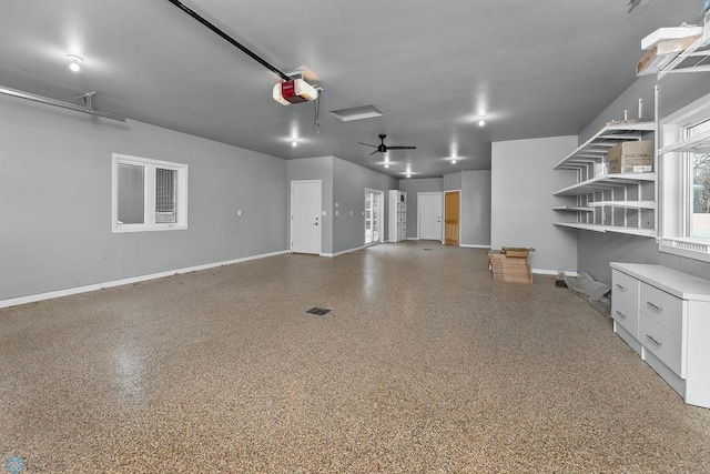 garage featuring a garage door opener and ceiling fan