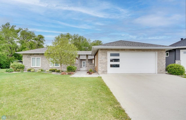1336 Goldenwood Dr, West Fargo, ND 58078 - view of front facade featuring a garage, stone siding, concrete driveway, and a front yard