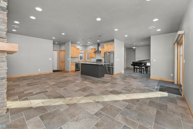 1336 Goldenwood Dr, West Fargo, ND 58078 - kitchen featuring high quality fridge, open floor plan, wall chimney range hood, baseboards, and recessed lighting