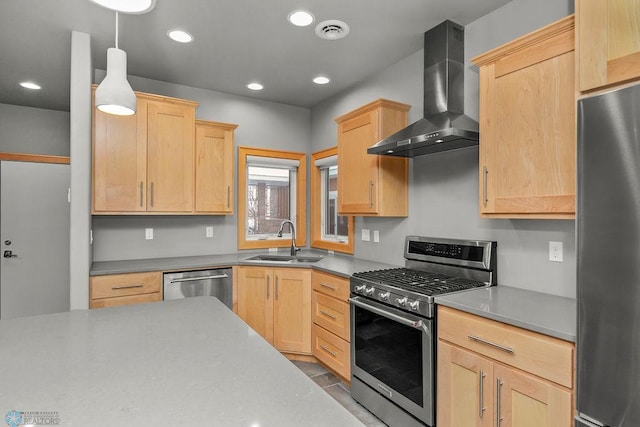 1336 Goldenwood Dr, West Fargo, ND 58078 - kitchen with stainless steel appliances, wall chimney exhaust hood, a sink, light brown cabinets, and decorative light fixtures