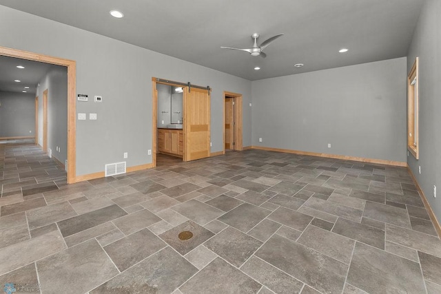 1336 Goldenwood Dr, West Fargo, ND 58078 - empty room with ceiling fan, a barn door, baseboards, and recessed lighting