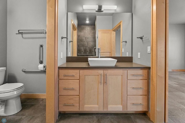 1336 Goldenwood Dr, West Fargo, ND 58078 - bathroom featuring toilet, vanity, and baseboards