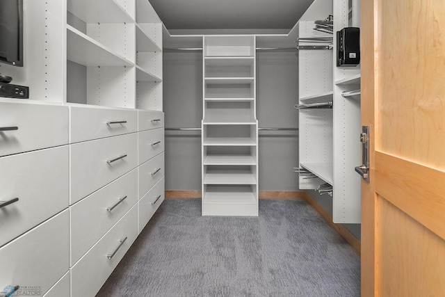 1336 Goldenwood Dr, West Fargo, ND 58078 - walk in closet featuring dark carpet