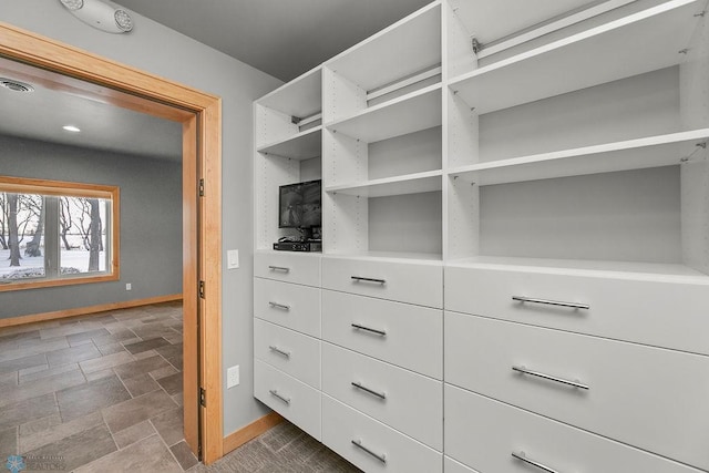 1336 Goldenwood Dr, West Fargo, ND 58078 - walk in closet featuring stone finish floors